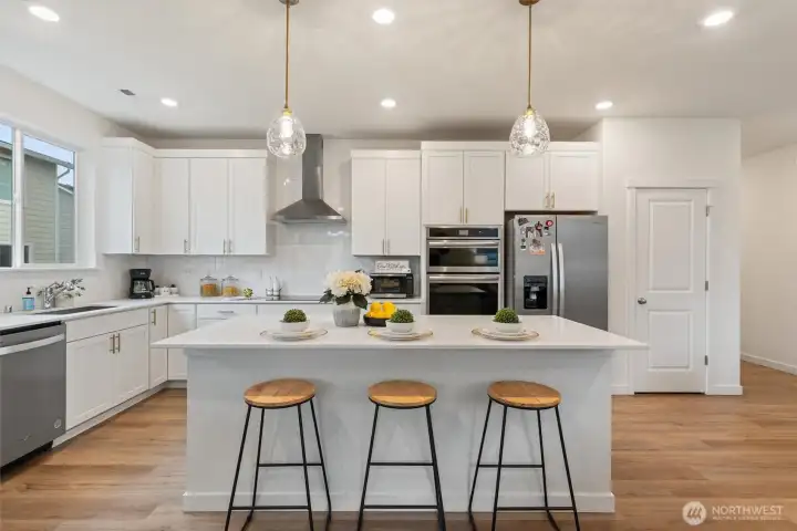 Expansive kitchen island with bar seating—perfect for casual meals, prep space, and entertaining.