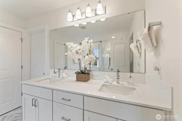 Additional bathroom vanity with clean, modern design and ample storage.