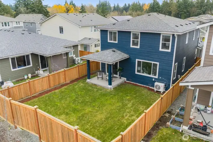 Aerial view showcasing the home’s lot and surrounding neighborhood.