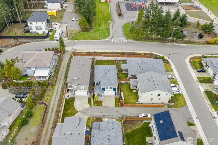Aerial view capturing the home’s location within a quiet, well-planned neighborhood.