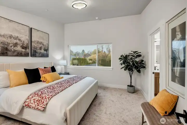 Primary bedroom with vaulted ceilings