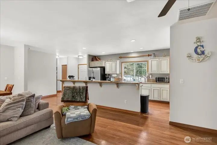 Unit A - Living room towards kitchen. Welcoming spacious floorplan.