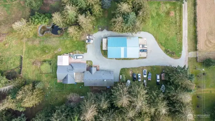 Aerial showing the layout of the property with the 2 ramblers (duplex) and massive 40 x 60 shop w/office. This does not include the 2 acres that is fenced.
