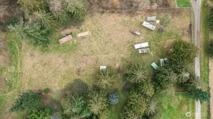 Approx 2 acres is fenced. Seller will be removing vehicles.