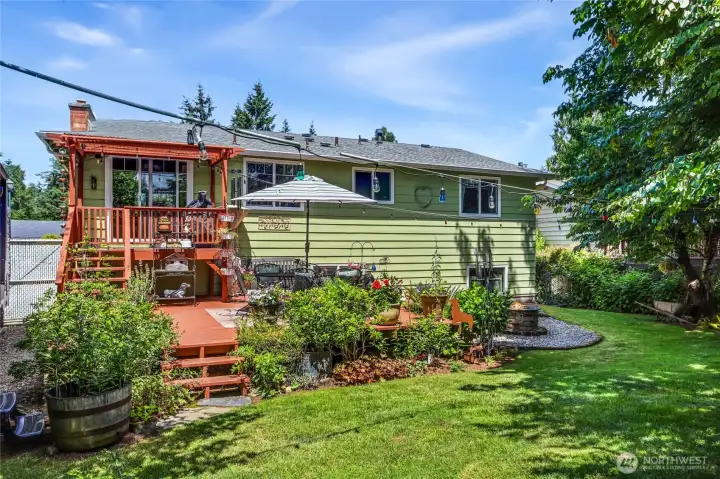 20’ x 20’ Wood deck with stairs to upper 6’x8’ deck with covered Pergola.   Gate at top of stairs.