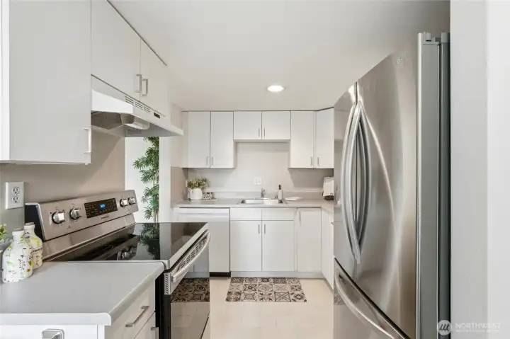 Updated kitchen appliances bring modern convenience to this thoughtfully designed space.