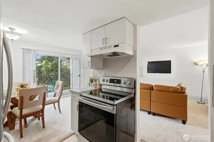 Kitchen features convenient dual entry points to both the living and dining areas.