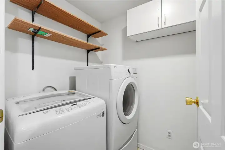 Laundry room with ample storage space.