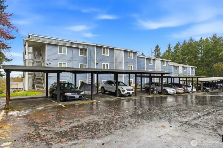 The front of the building offers additional unassigned parking and sits directly across from the serene Salt Air Vista Park.