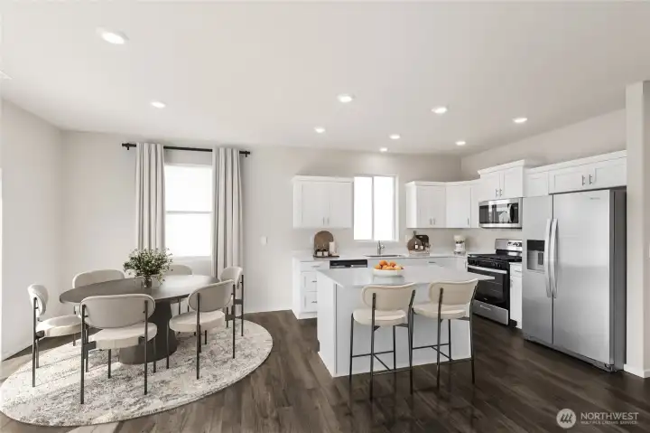 Cozy kitchen with breakfast bar Plus dining area. Pictures are for representation only colors and options may vary.