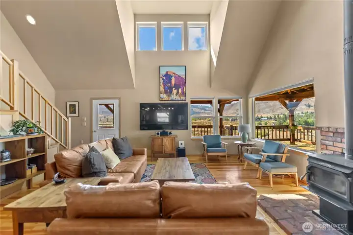 The family room with wood burning stove.  A cozy place to come together and enjoy the bright light of picture windows and good company.