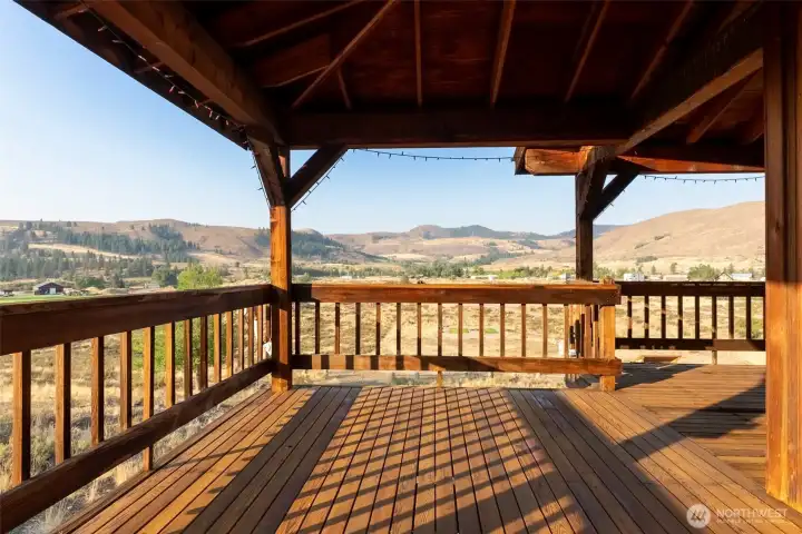 Looking west towards Patterson Lake area and Sun Mtn.  A wraparound deck with lovely territorial and mountain views.