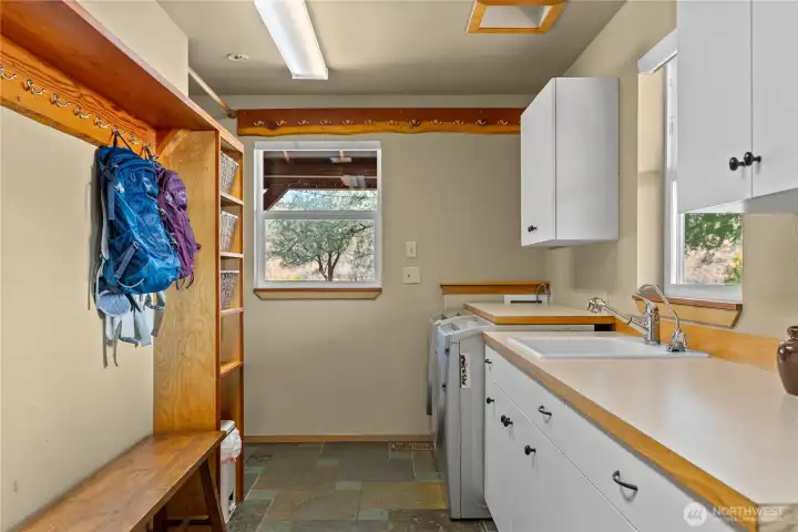 Laundry and gear room, with an entrance to the outside deck- making taking off wet and muddy clothes very easy!