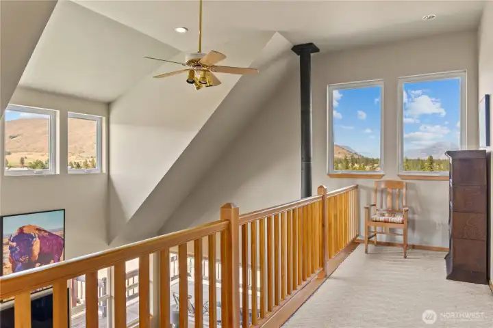 Upstairs landing with a bright and airy feeling- beautiful vistas out every window!