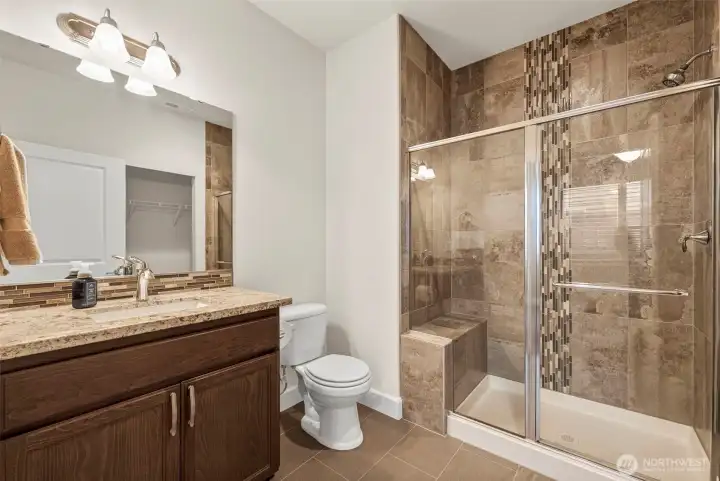 3/4 bathroom attached to main level suite.