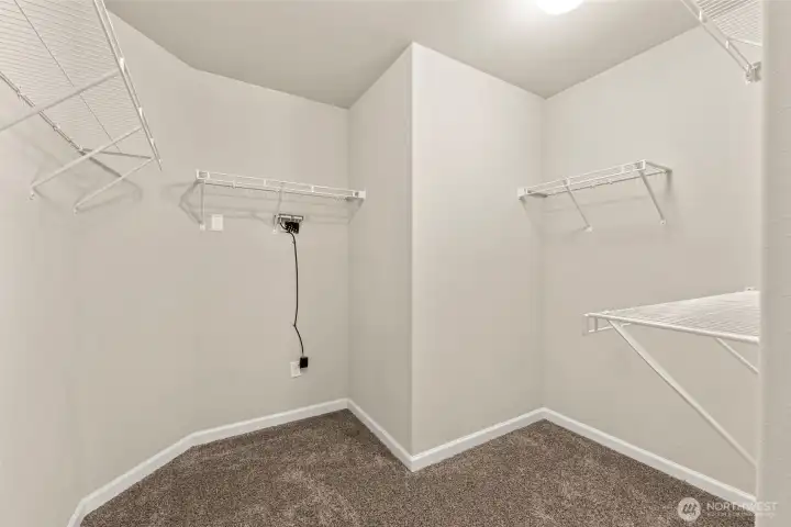 Primary bedroom walk-in closet.