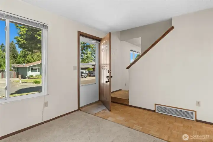 Step inside, bright entry with a peek upstairs.