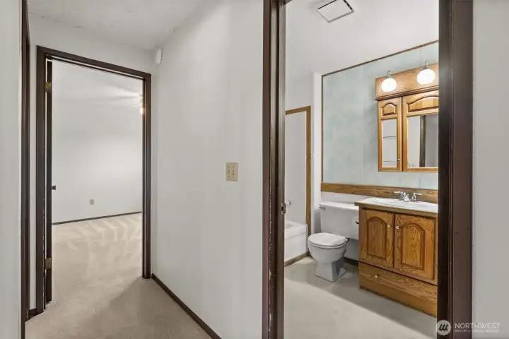 Upstairs hallway with a bathroom right there.