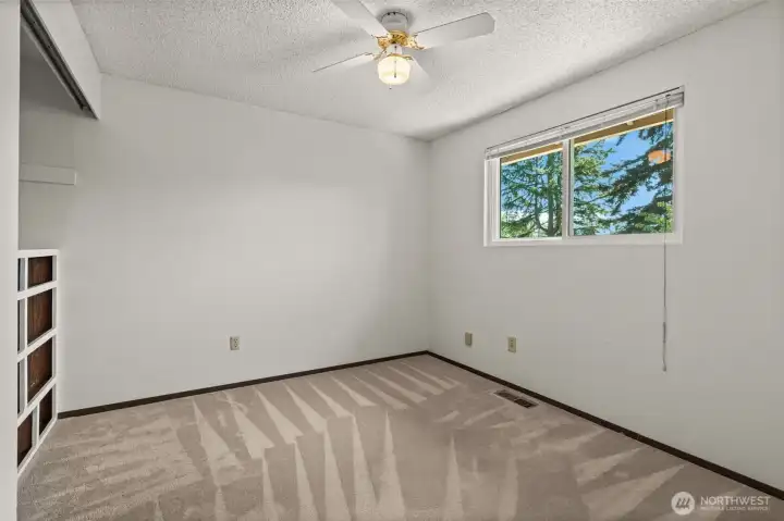 Bedroom #3 - Bright bedroom with closet and treetop view.