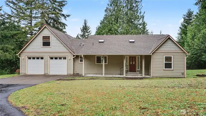 Home is situated on just shy of 3 private acres in Shelton.