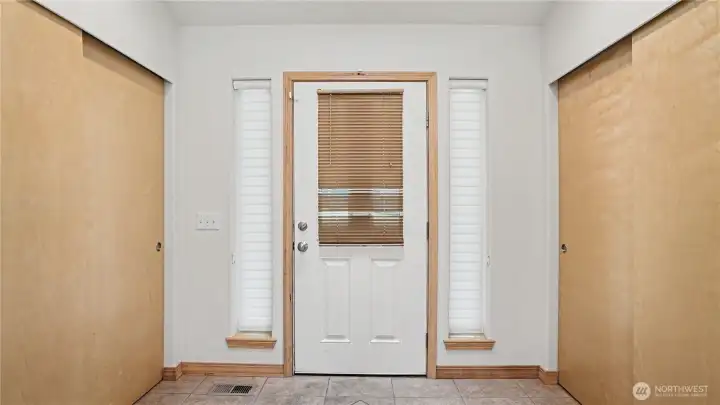 Looking at the front entrance door, two large closets provide an abundance of storage.