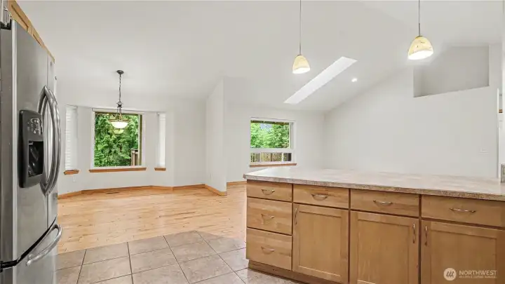 Another perceptive of the kitchen looking out at the dining area and living room.
