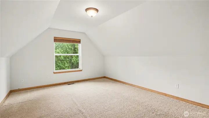 Versatile flex space ideal for guests, a home office, or creative workspace.