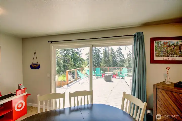 Full dining area off the kitchen, looks onto the deck