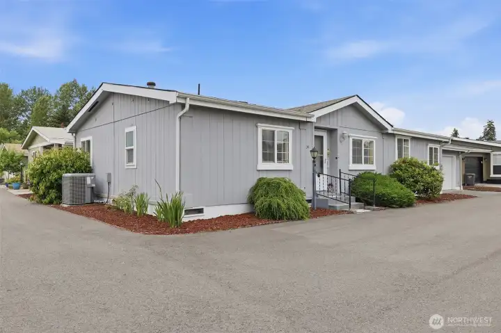 Home is situated on corner lot a the south end of the community across from the RV parking lot. Mature plants and shrubs border the home with year round color and greenery.