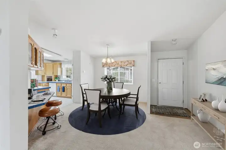 Parque flooring at the formal entry into the open living room area. Formal off Dining room area just steps from the kitchen and will fit table and 6-8 seatings. Virtually staged.