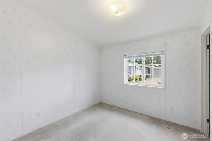 Guest bedroom on the SE corner of the home. It also has a walk-in closet. Use as exercise area, den or ?