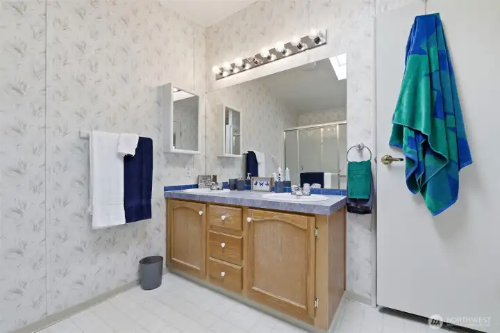 Primary, private bath has double sinks for your convenience. Walker/ wheelchair accessible. Grab bars for your safety. HUGE linen closet for all you bath necessities , towels etc.