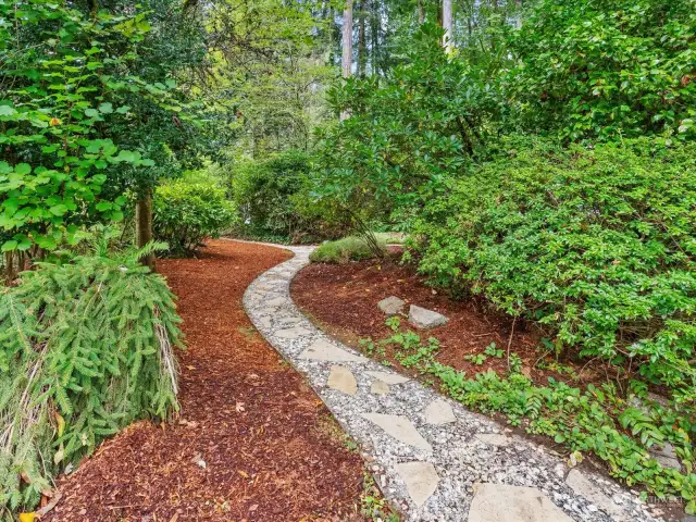 Wonderful trails around house lead to garden area, shed and backyard