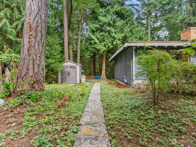 Wonderful trails around house lead to garden area, shed and backyard