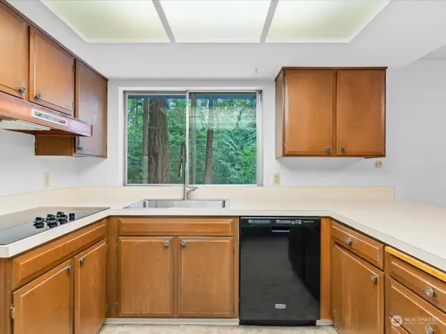 Kitchen area connects to dining room and kitchen sitting area