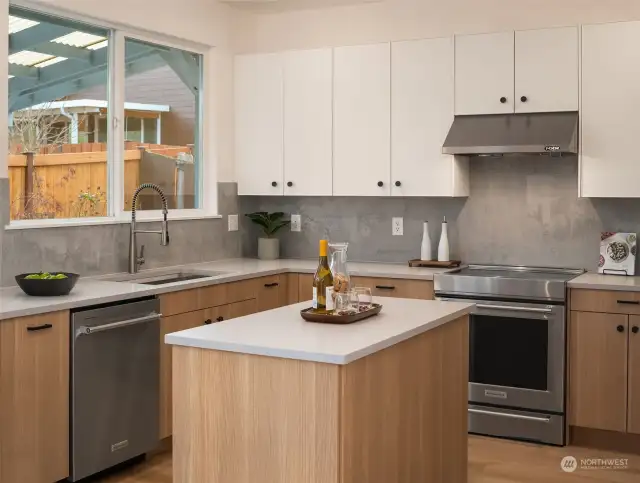 Gorgeous island kitchen with brand new KitchenAie appliances and garden window