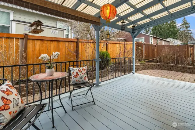 Large covered patio wrapped in paver patio