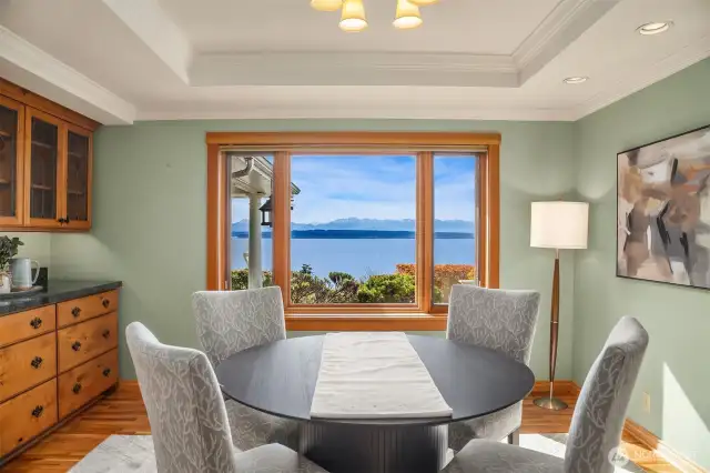 Formal dining with built-in buffet and cabinetry for easy organizing. Enjoy stunning sunsets and panoramic views.