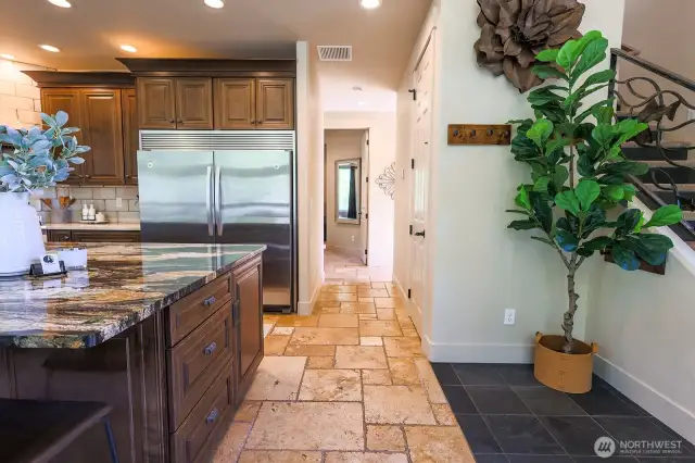Kitchen hallway leading to Primary, Laundry, Powder room and storage