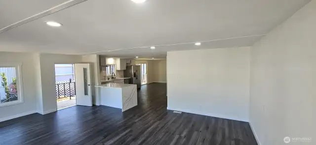 Living room looking East towards Kitchen and Dining room