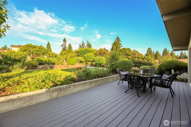 The deck off the primary suite overlooks the back yard.