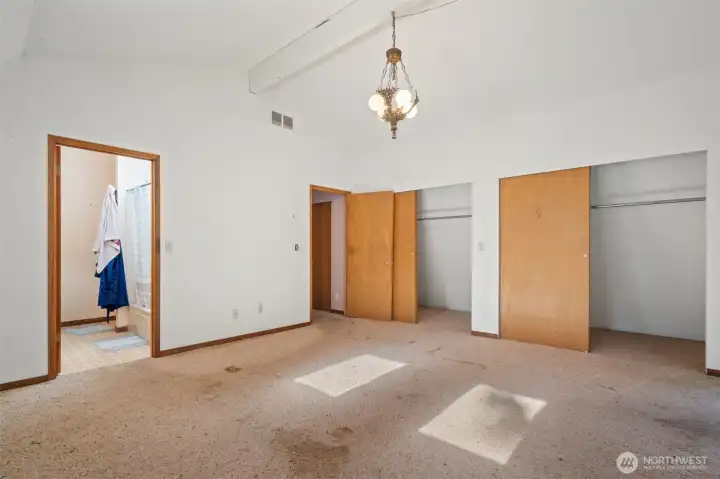 Primary bedroom with dual closets