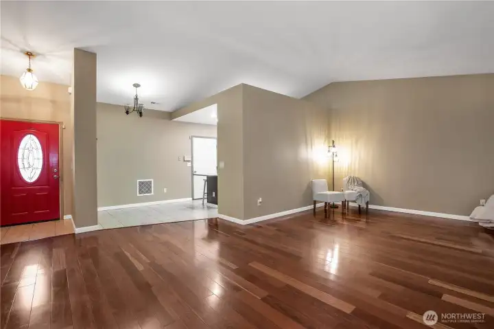 Coming out of the kitchen is the living room, newer paint on inside of home