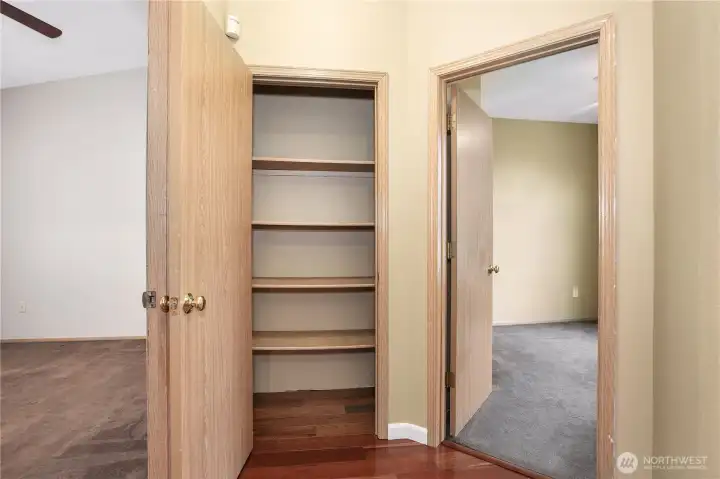 At the end of the hall is a linen closet and 2nd bedroom on the right and primary bedroom on the left