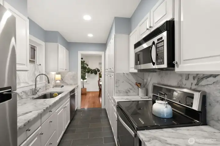 Stainless appliances and generous stainless sink make for clean lines.  Plenty of cabinets means there is a space for everything!