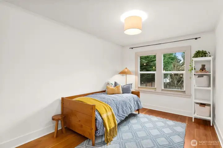 Generous main floor bedroom looks out to the activity in back yard.