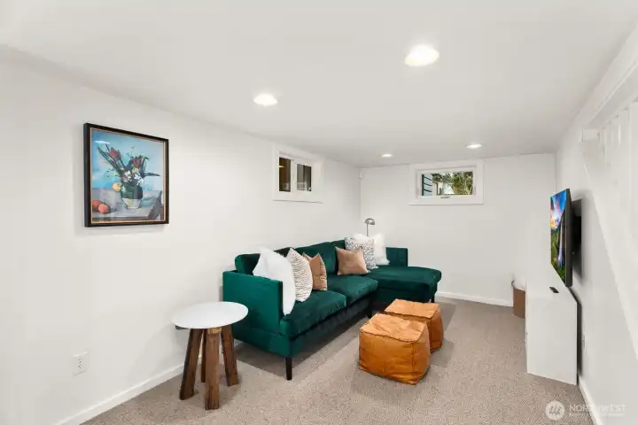 Spacious lower level is a great place for a hang-out space, an office, or even a 4th bedroom! with closets!