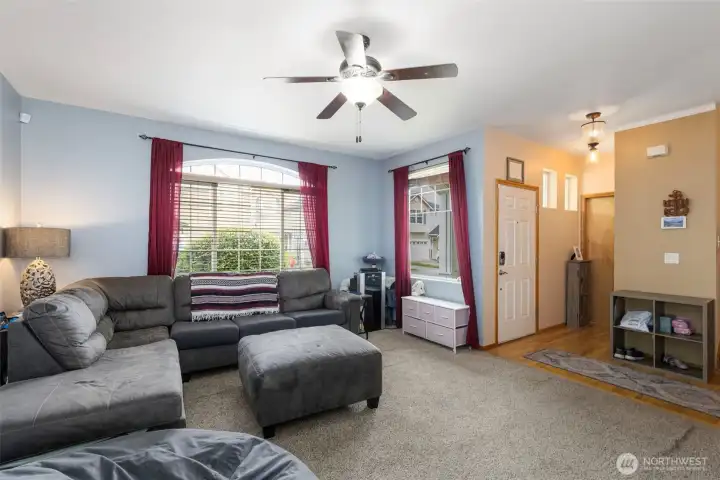 Living Room, entry, and hall to half bath.