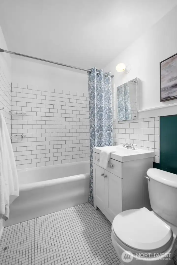 your updated bathroom with a couple original touches awaits