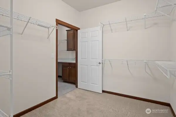 Main closet leading to laundry